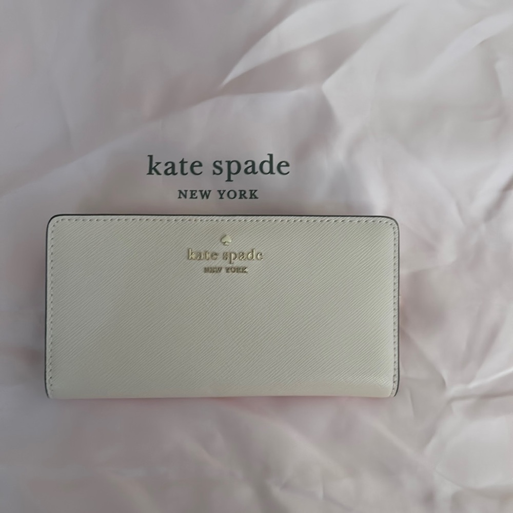 Kate Spade Large Slim Madison Bifold Wallet in Conch Pink